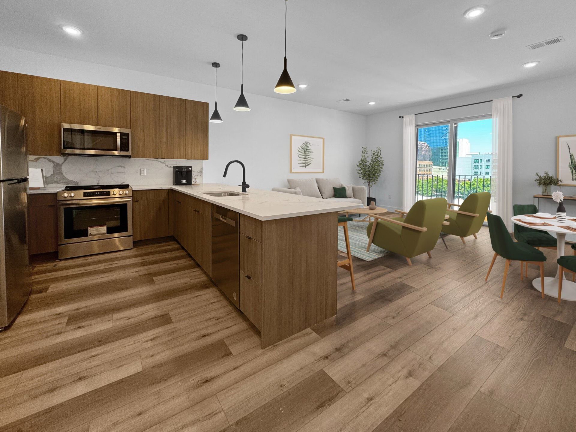 Open-concept kitchen and living area with wood cabinets, island, and seating, light blue walls, and a view through a sliding door.