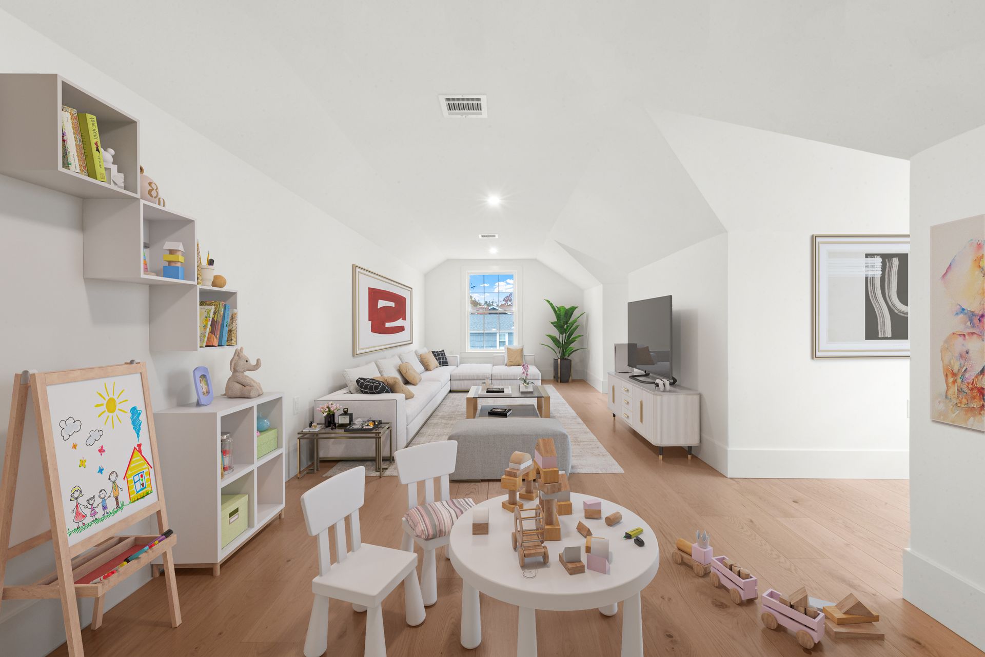 Bright white playroom with kid's furniture, sofa, TV, and artwork, with a view of water.
