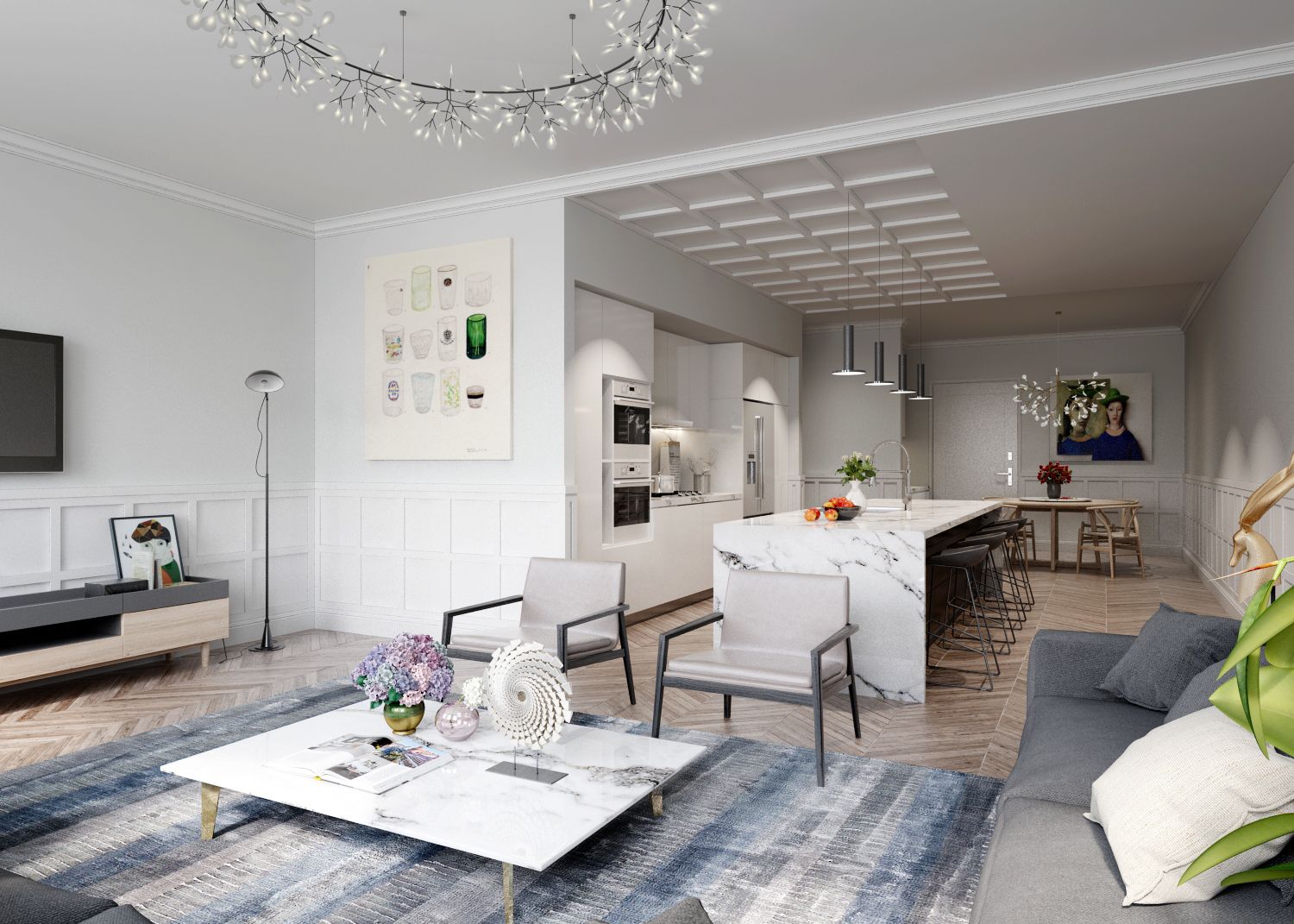 A modern living room with open kitchen. White walls, marble island, blue rug, gray furniture, chandelier.