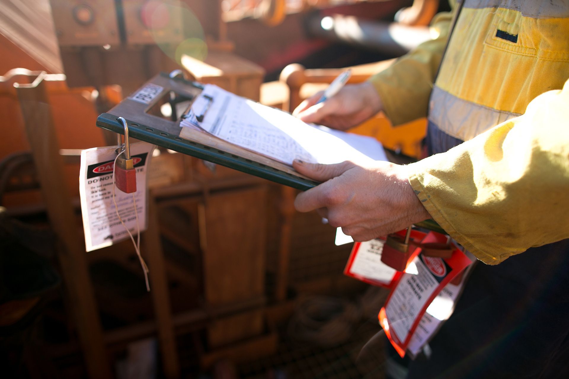 Man Checking the List on Clipboard
