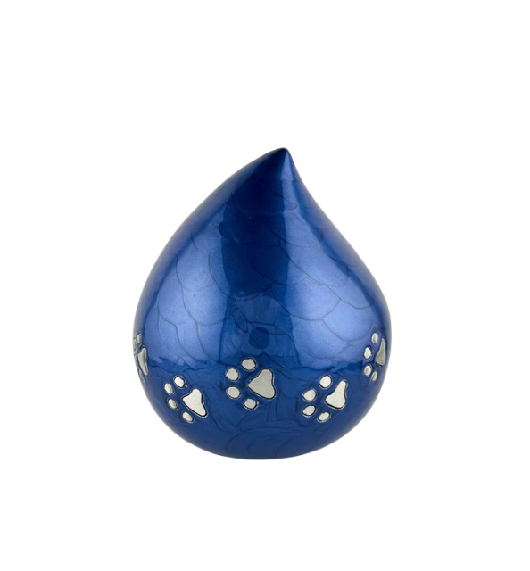 Blue teardrop-shaped glass pendant with white floral accents on a white background