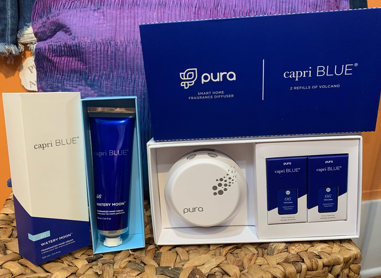 Purple and white Pura Capri Blue fragrance gift set with diffuser, bottle, and refills in open packaging
