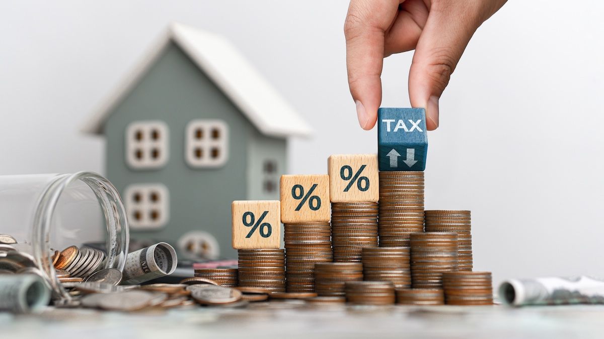 Property Taxes Demonstrated Using Blocks With Percentage Marks & Coins