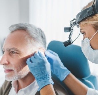 putting hearing aid