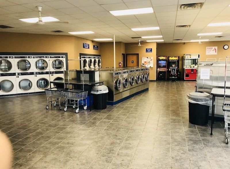 A laundromat with a lot of washers and dryers