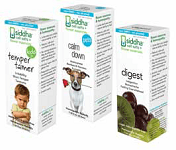 Boxes of Siddha cell salts supplements: temper calmer (child), calm down (dog), digest (fruit).