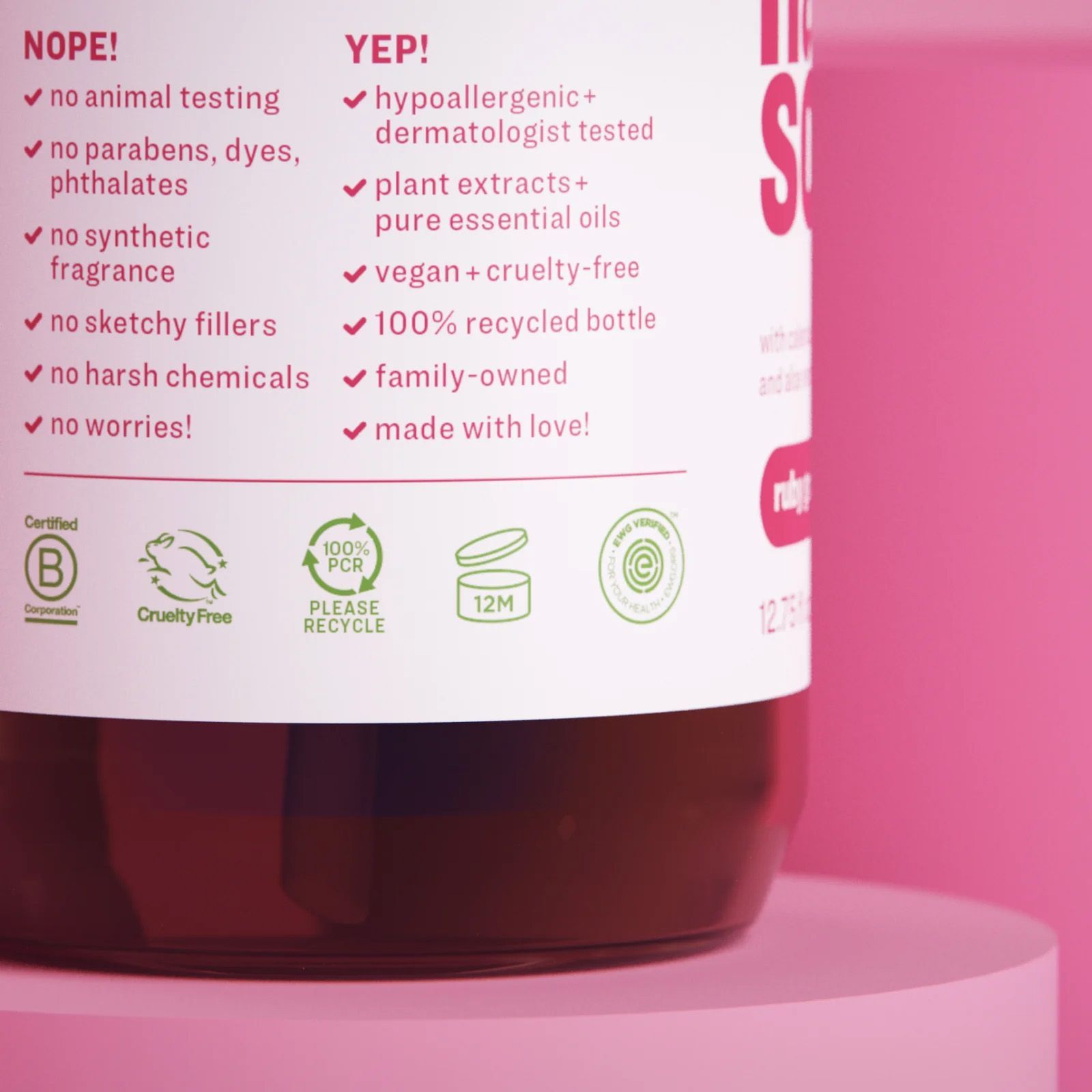 Close-up of a pink bottle with a list of