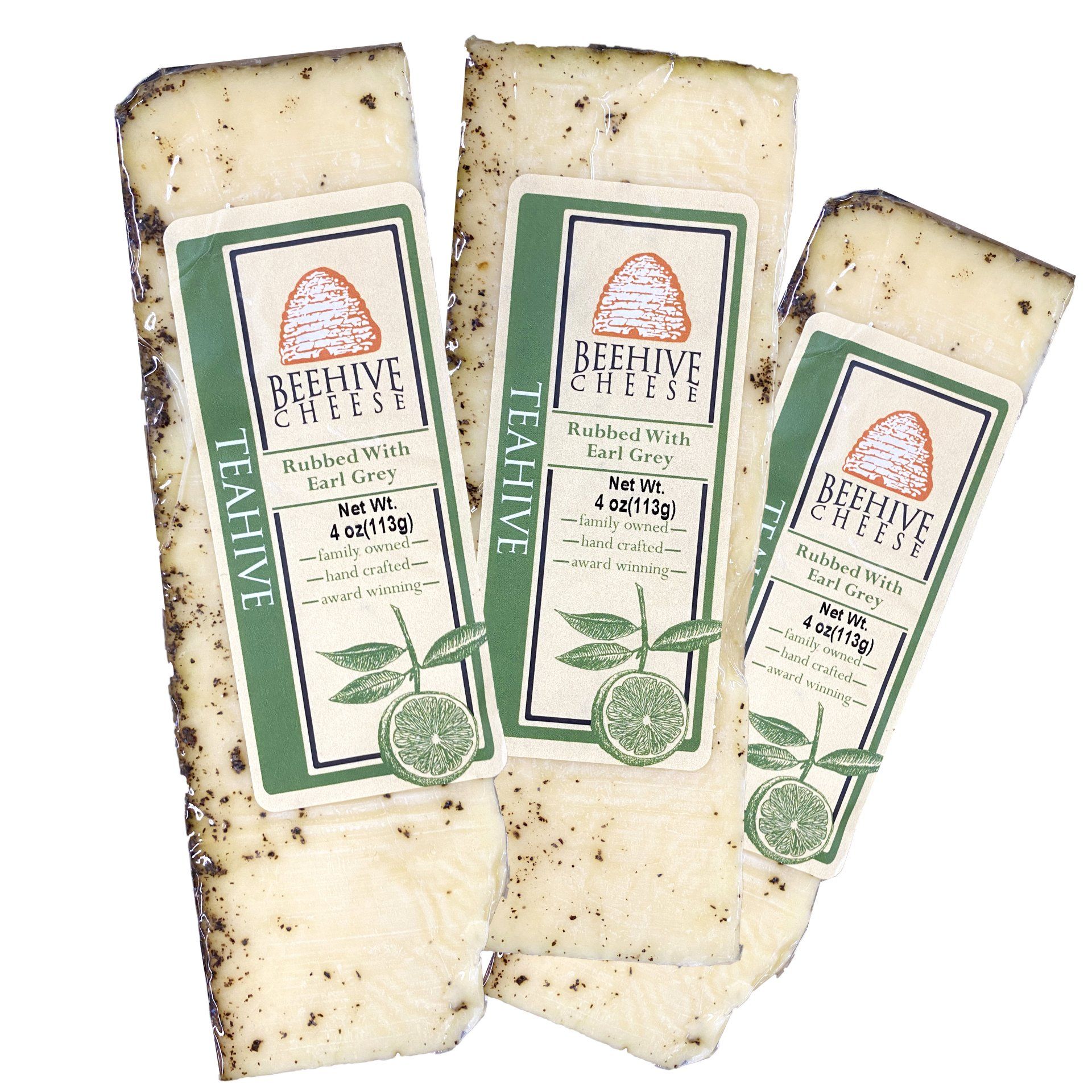 Three slices of Beehive Cheese Teahive, each with a label featuring a beehive and lime illustration.