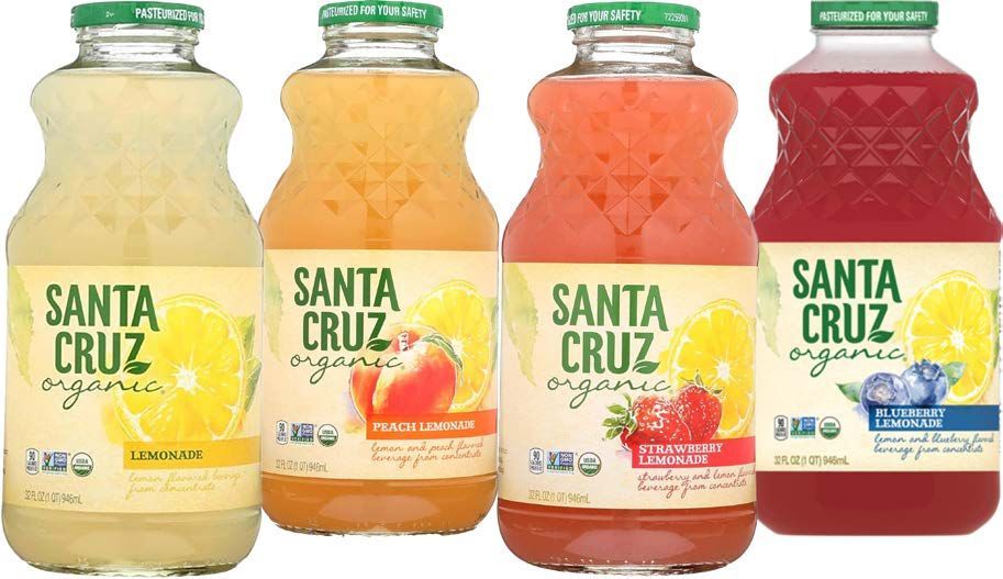 Four bottles of Santa Cruz organic lemonade in different flavors, featuring lemons and berries.