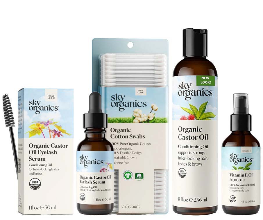 Sky Organics skincare products: eyelash serum, castor oil, cotton swabs, and a vitamin E serum.