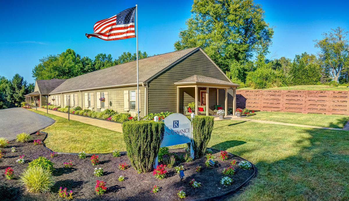 A house with an american flag flying in front of it.