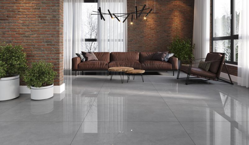 Azulejo rectangular de color gris con superficie texturizada, posiblemente para suelo o revestimiento de pared.