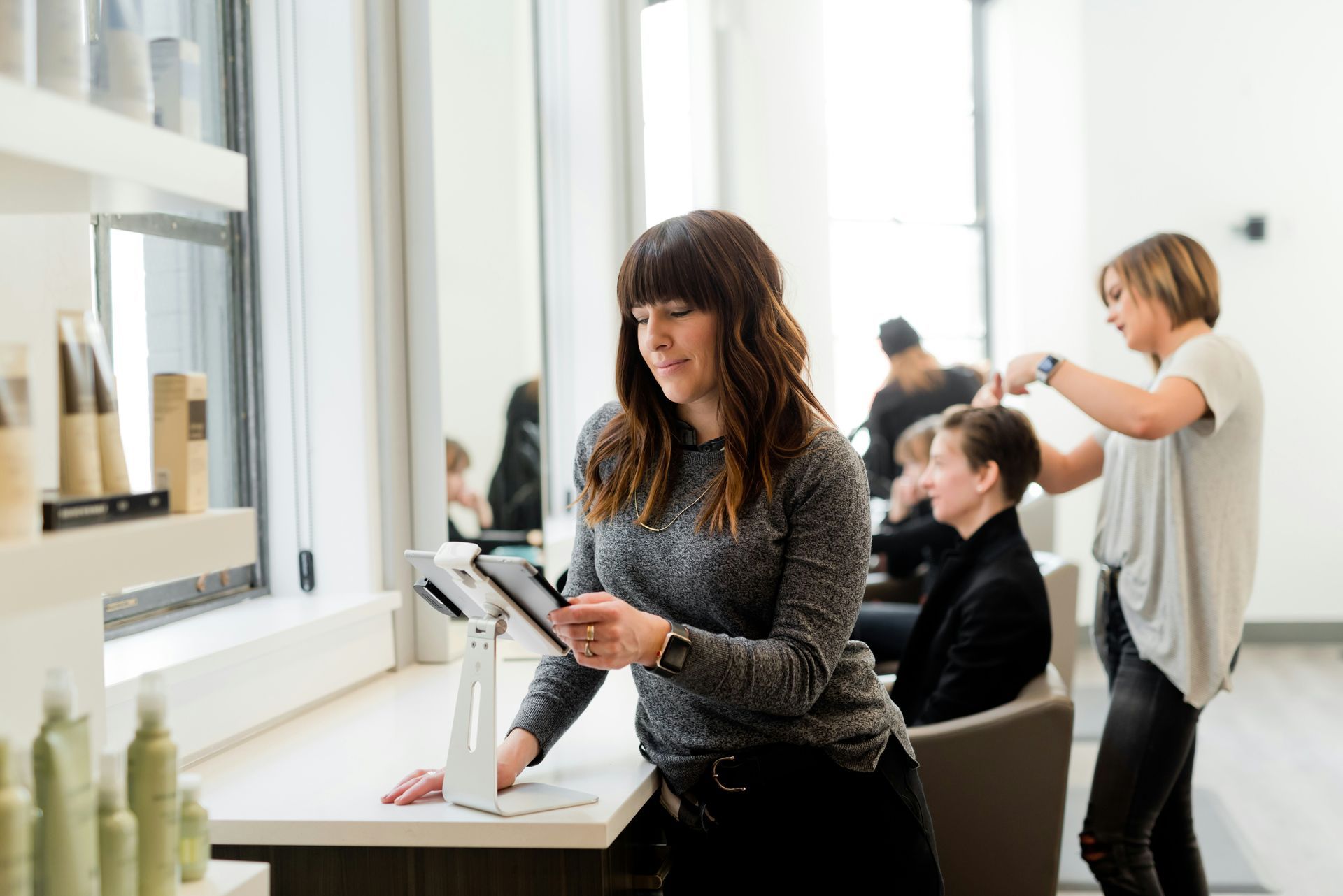 A business owner uses an ipad tp check their financial statement