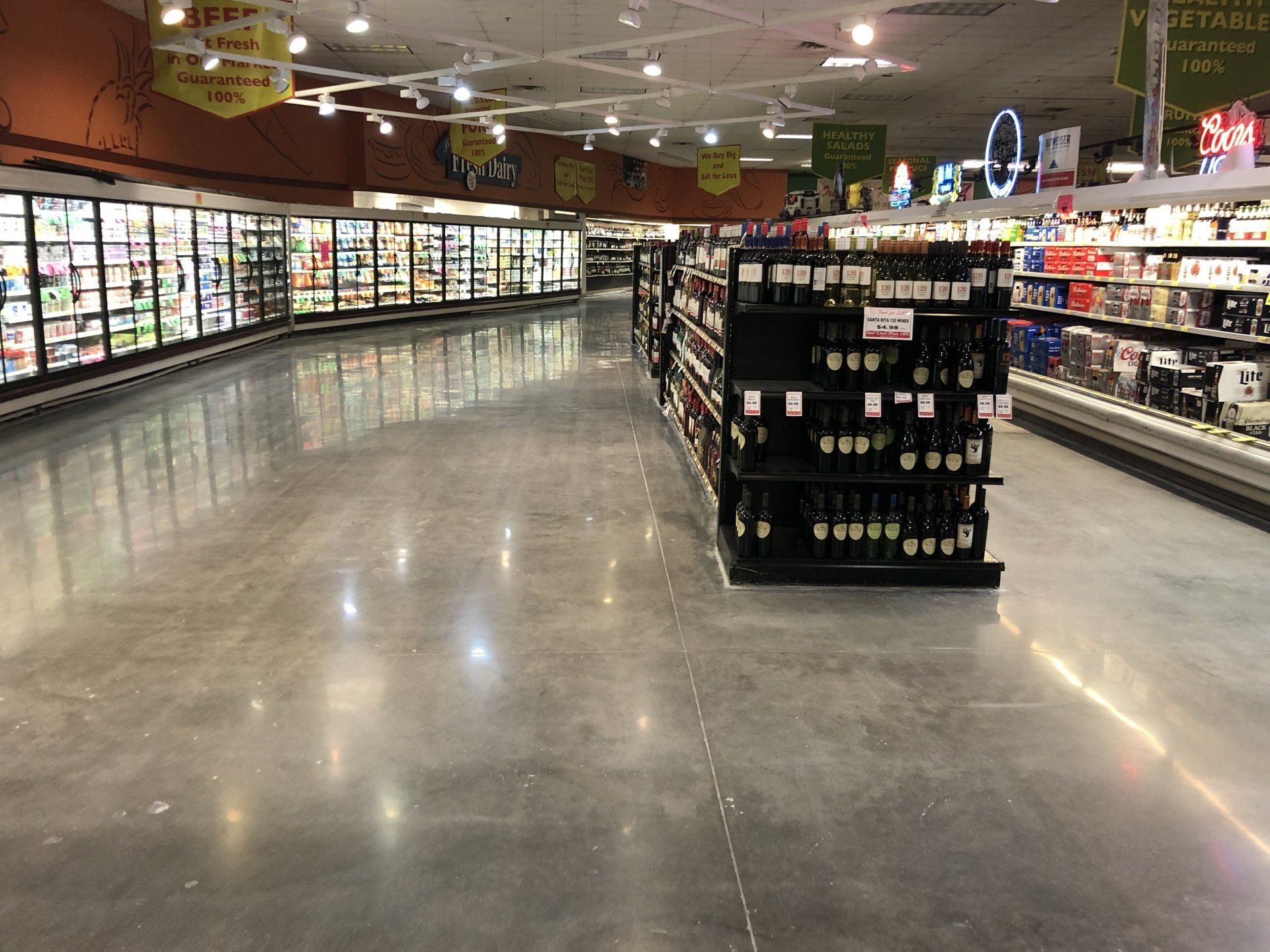 The inside of a grocery store with a lot of shelves.