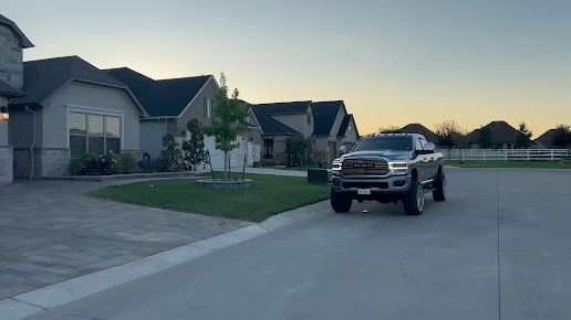 Lonestar Customscapes truck parked on suburban street in Denton TX
