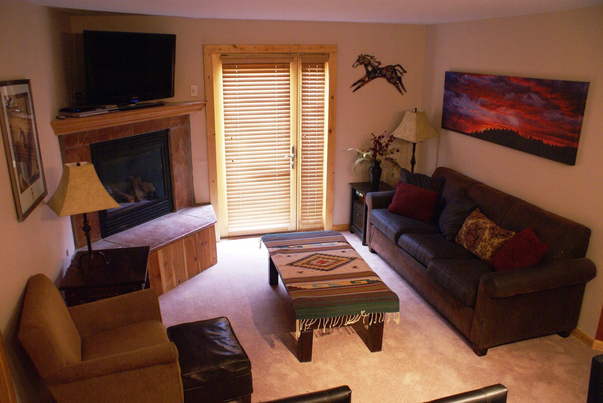 A living room filled with furniture and a fireplace