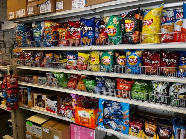 There are many different types of chips on the shelves in this store.