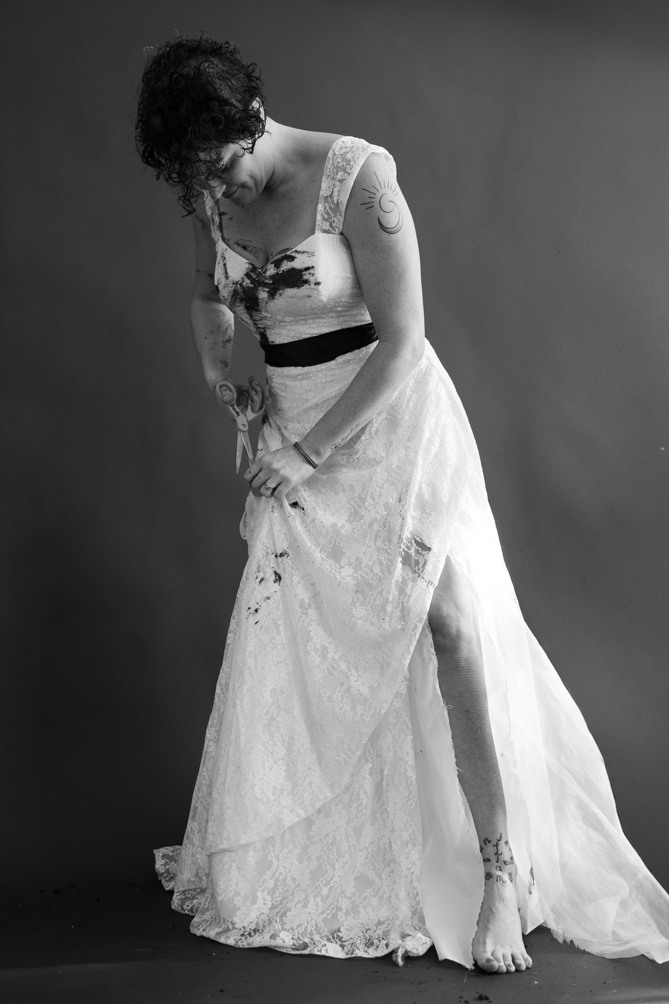 A black and white photo of a woman in a wedding dress