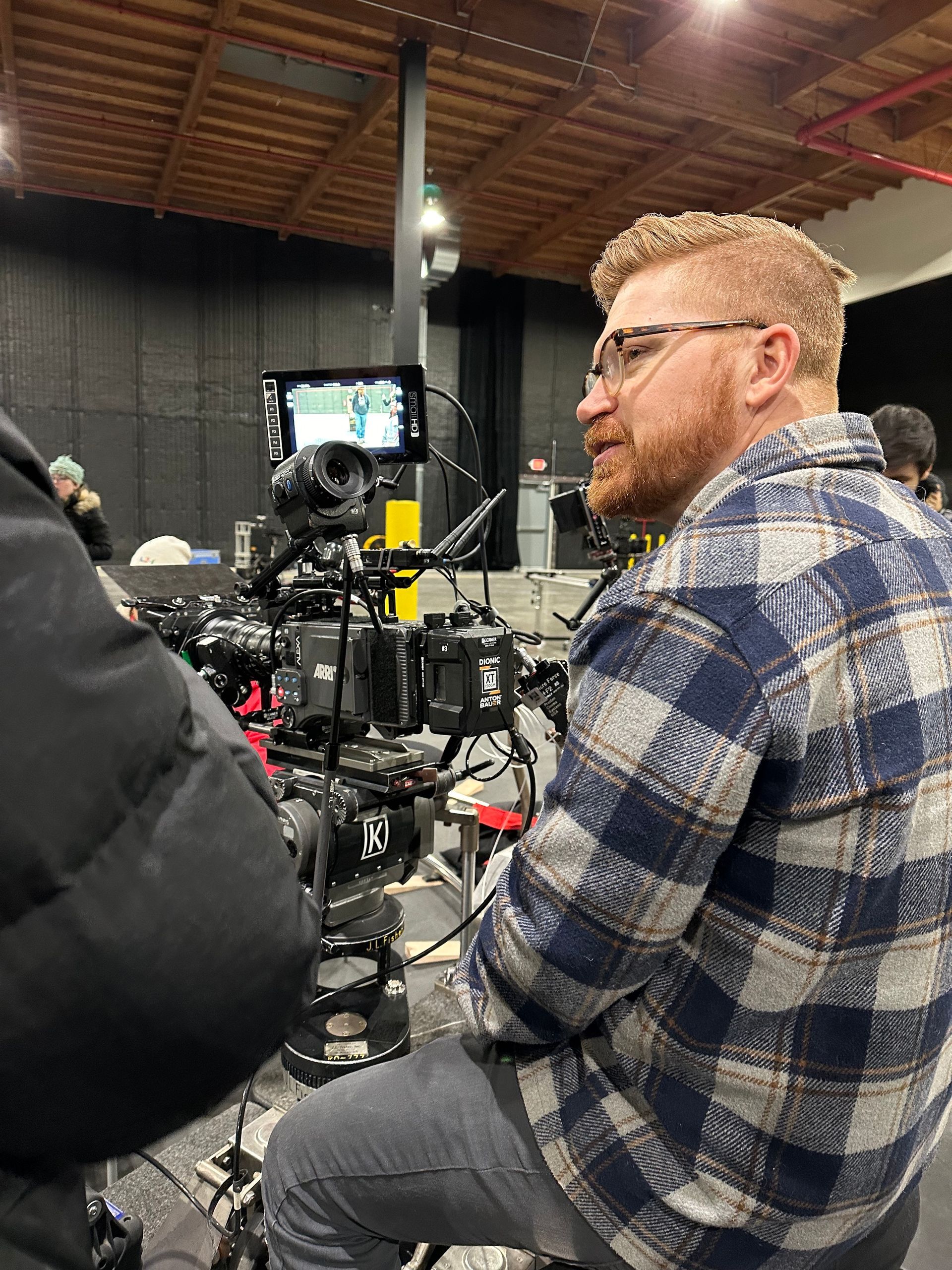 Paul Boyer from BMG sitting in behind an Arri camera between shots