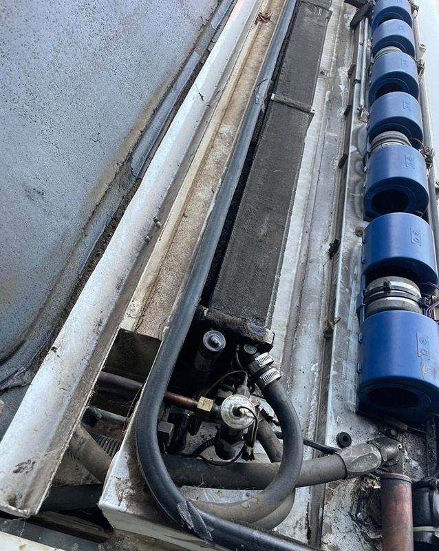 A Close-up Of A Machine With A Hose Attached To Refrigeration — Autocool Air Conditioning in Raymond Terrace, NSW