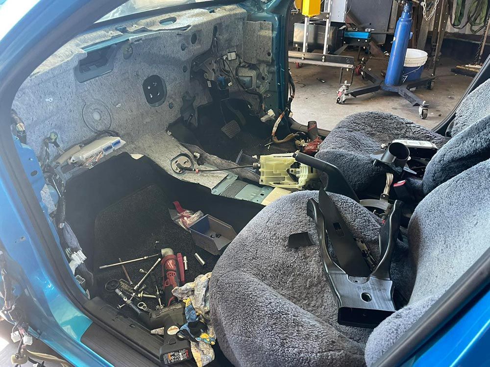 The Inside Of A Blue Car With The Seats Removed — Autocool Air Conditioning in Raymond Terrace, NSW