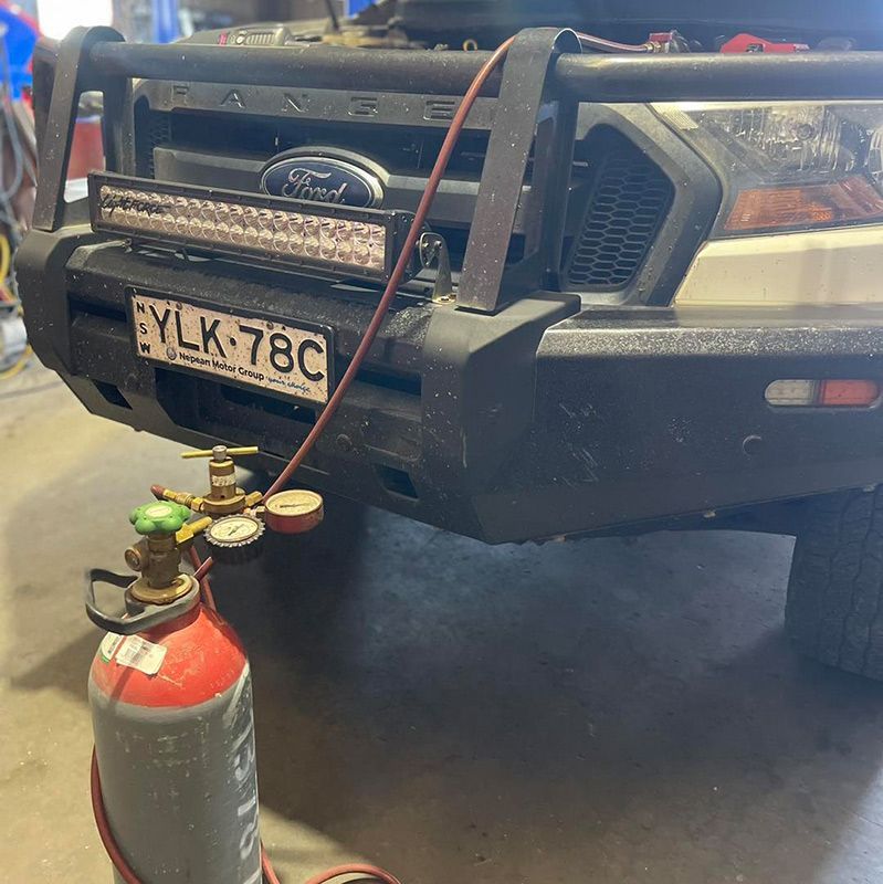 Repairing Th Air Conditioning On The Ford Vehicle — Autocool Air Conditioning in Raymond Terrace, NSW