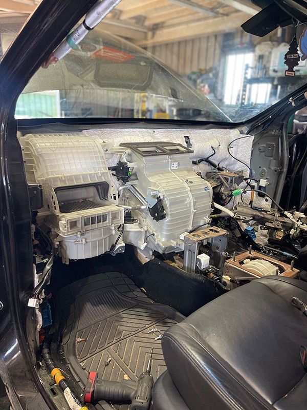 Inside Of A Car Is Being Worked On In A Garage — Autocool Air Conditioning in Raymond Terrace, NSW