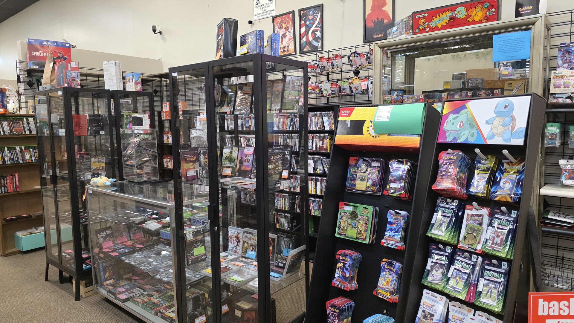 Vintage video game cartridges and console on wood shelving