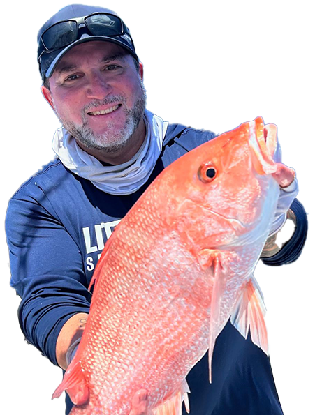 Smiling person in blue holds a large red fish against a white background