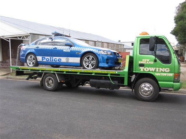 Police Car on Towing Truck — New England Towing in Armidale, NSW