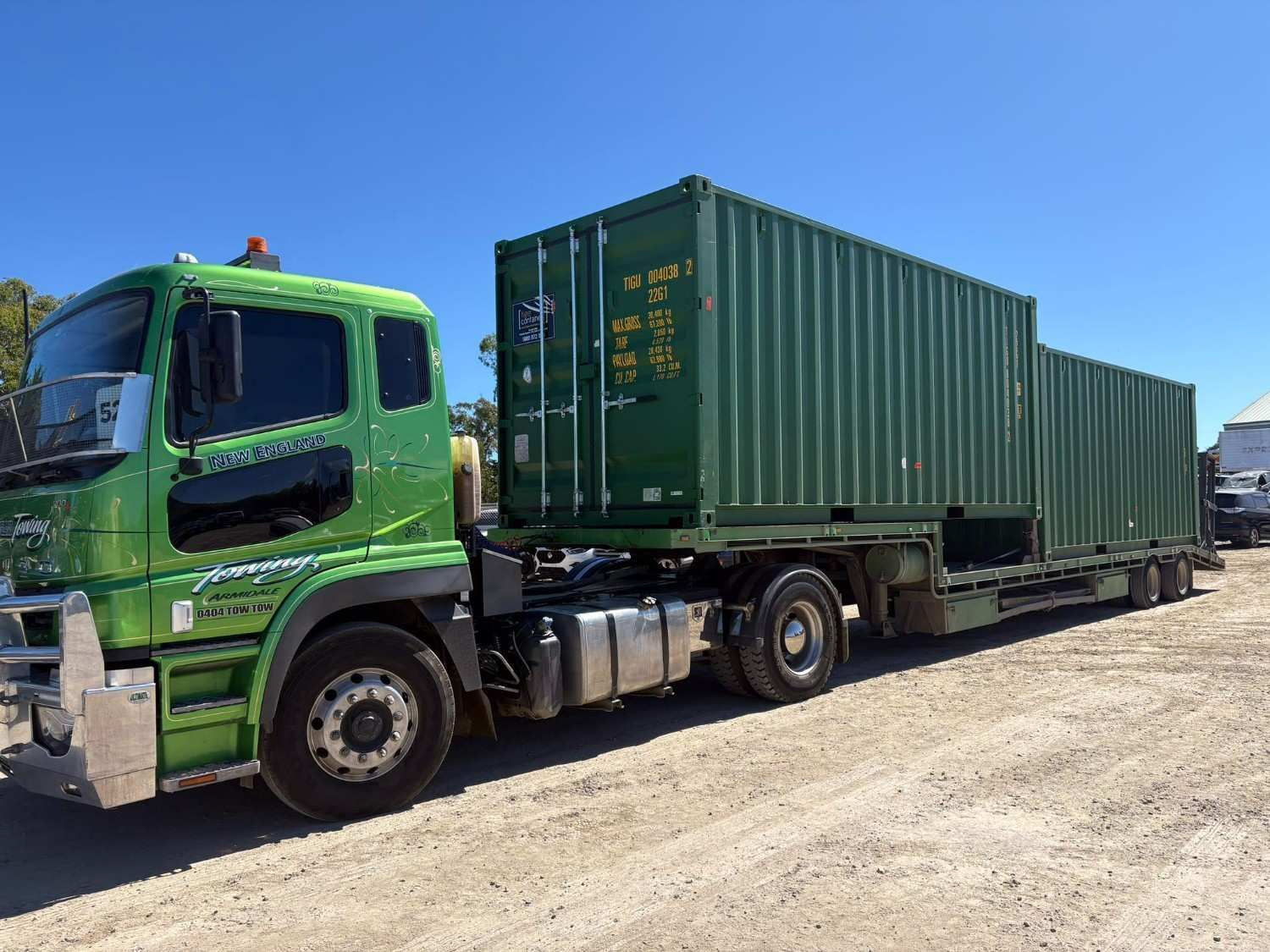 Green Semi-Truck Hauling Two Green Shipping Containers — New England Towing in Ebor, NSW