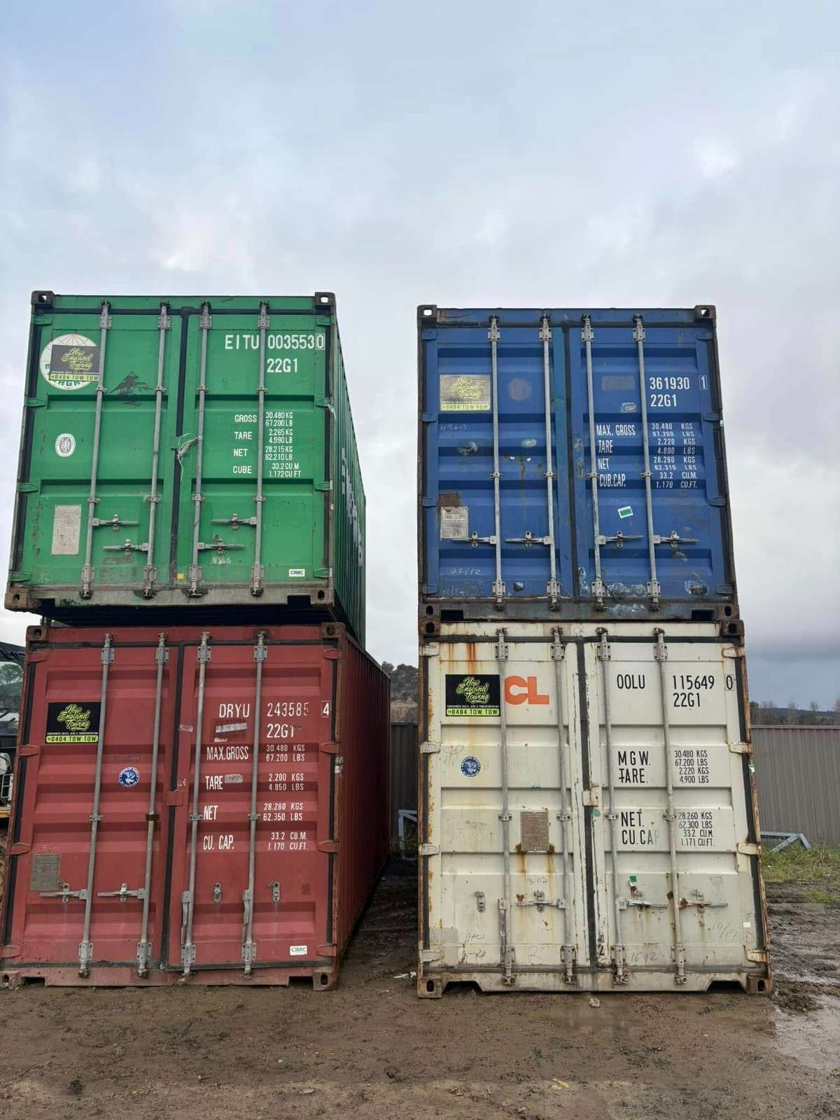 Four Stacked Shipping Containers: Red, White, Green, and Blue — New England Towing in Walcha, NSW