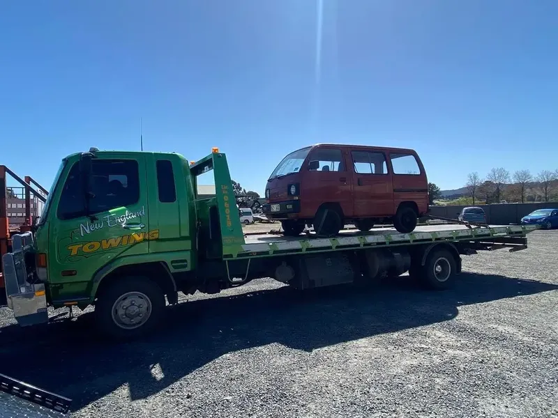 Towing A Black Car — New England Towing in Armidale, NSW