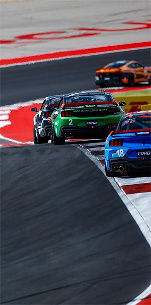 Max Opalski's green Dark Horse Mustang on the Circuit of Americas track in 2024.
