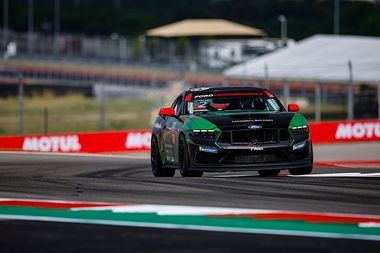 Max Opalski's green and black Darkhorse Mustang is driving on Circuit of Americas.