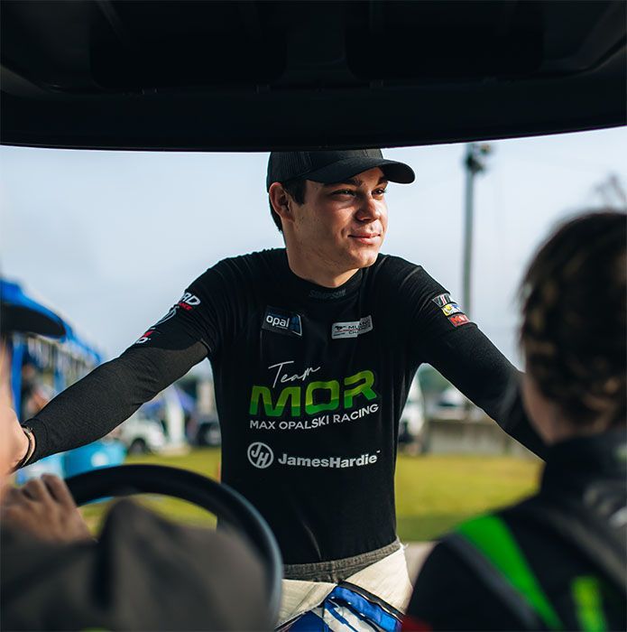 Max Opalski wearing a black team shirt at the Circuit Of Americas