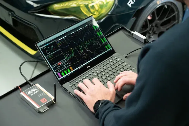 Team MOR technician reviewing race data and making tweaks to the car software.