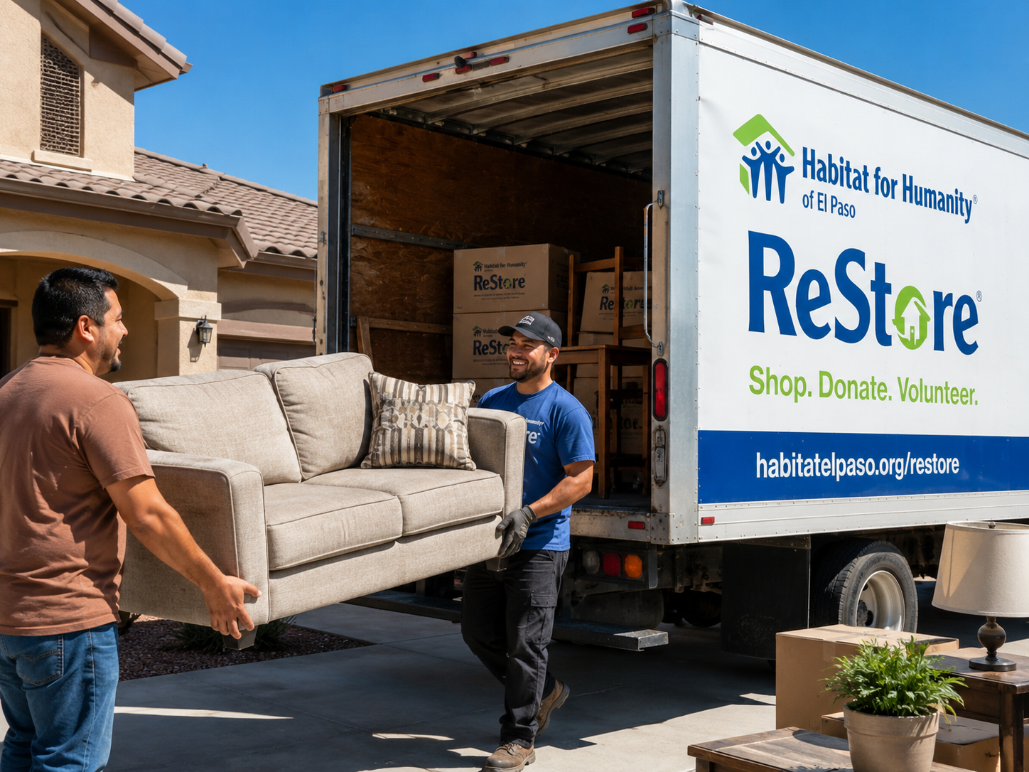 Alt text (under 100 characters):
Habitat ReStore driver accepts a sofa donation from a homeowner