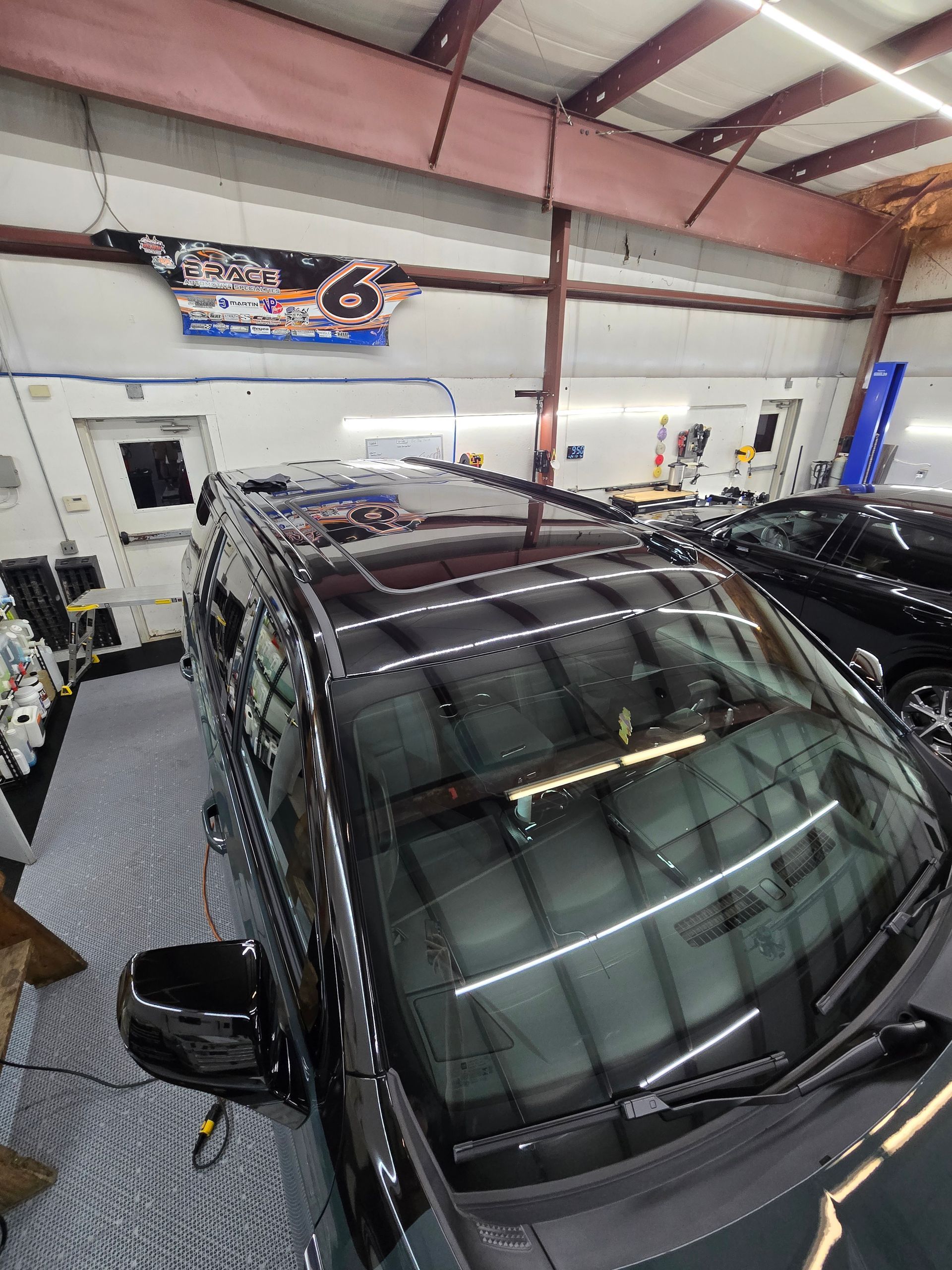 Black PPF on roof and vinyl-wrapped pillars on GMC Yukon AT4 at Keystone Detail