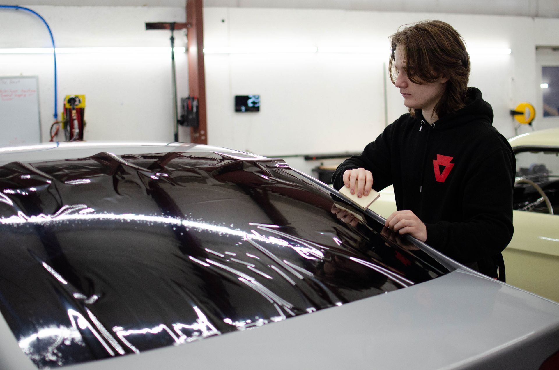 Buffing, polishing, and paint correction on used vehicle to prep for ceramic coating installation in Harborcreek, PA