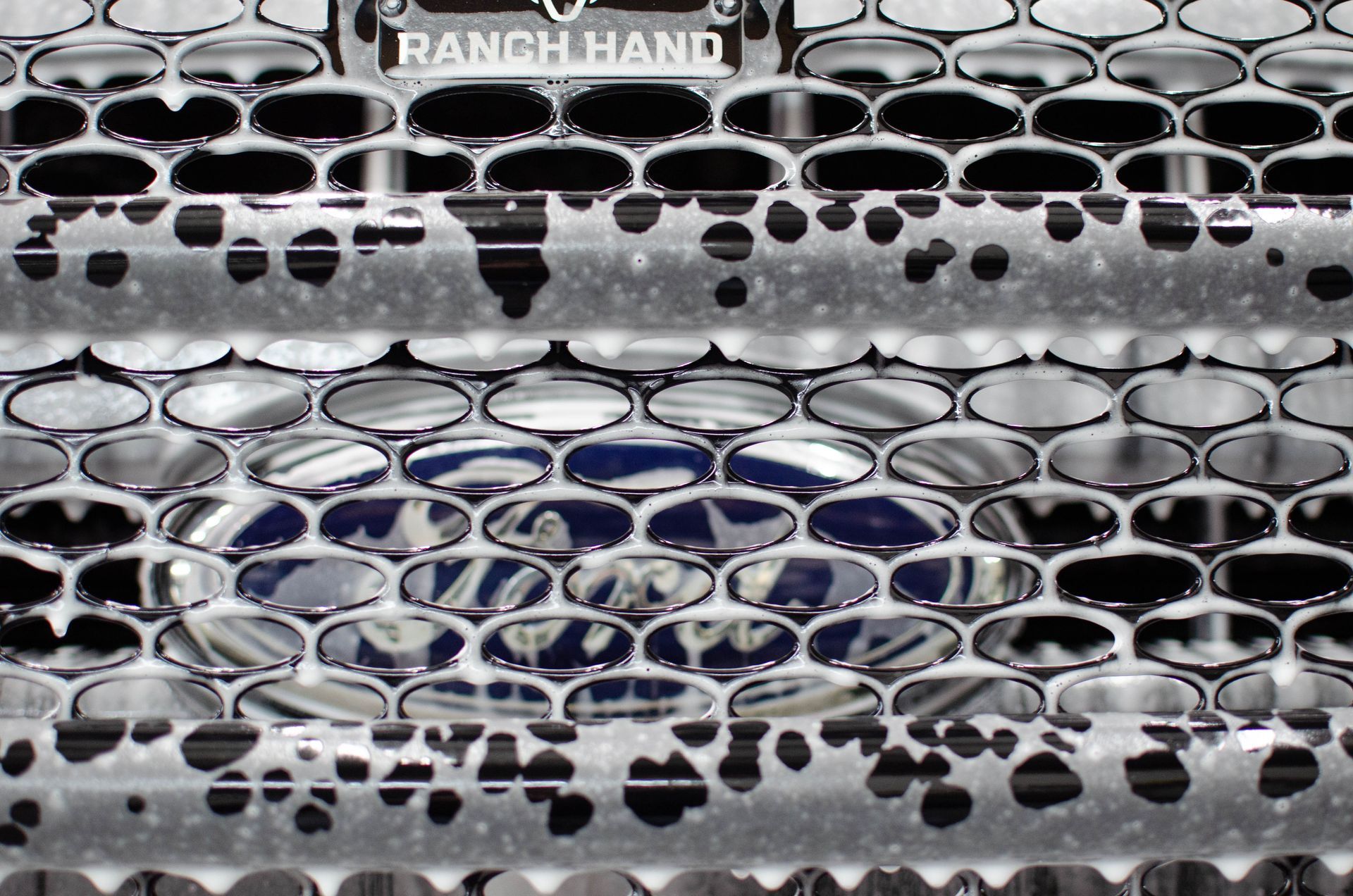 Ranch Hand vehicle grille with a cracked, black-and-white camouflage pattern