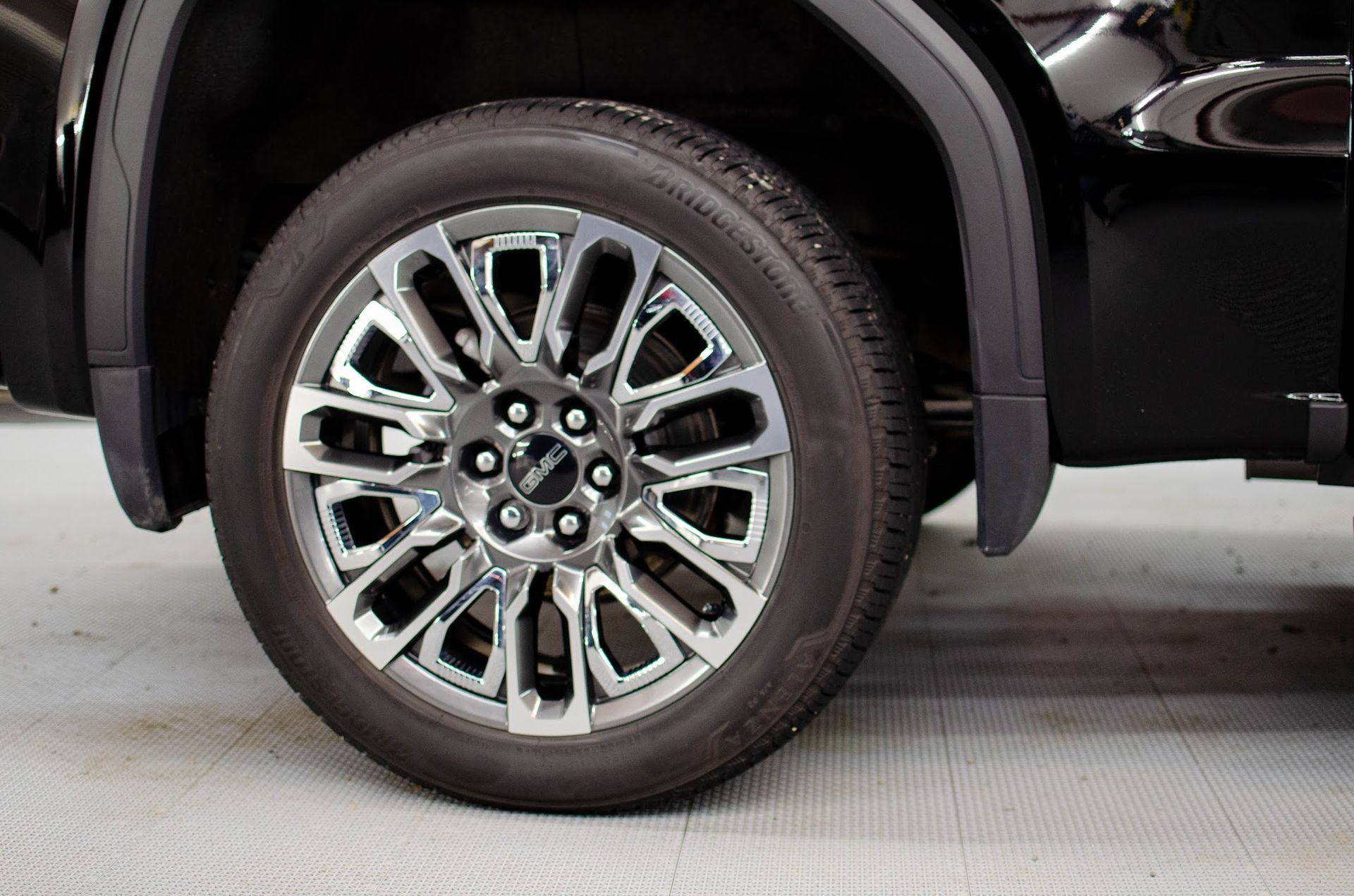 Wheel and tire on a ceramic coated GMC Sierra at Keystone Detail in Waterford, PA