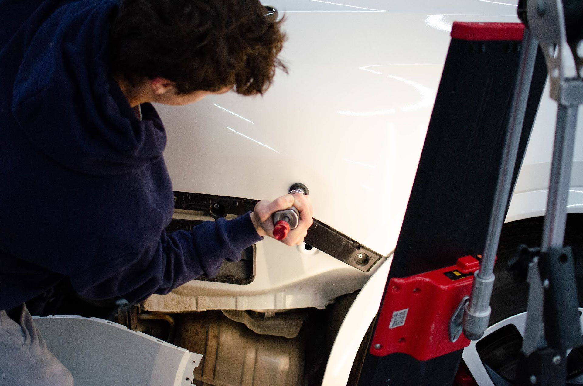 Keystone Detail technician working on a vehicle inside the Waterford, PA shop