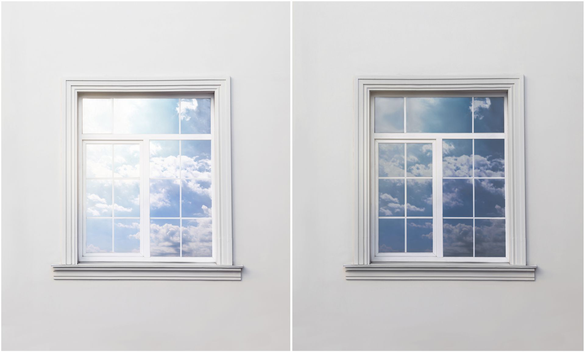 Two side-by-side white-framed windows showing bright daylight and clouds outside