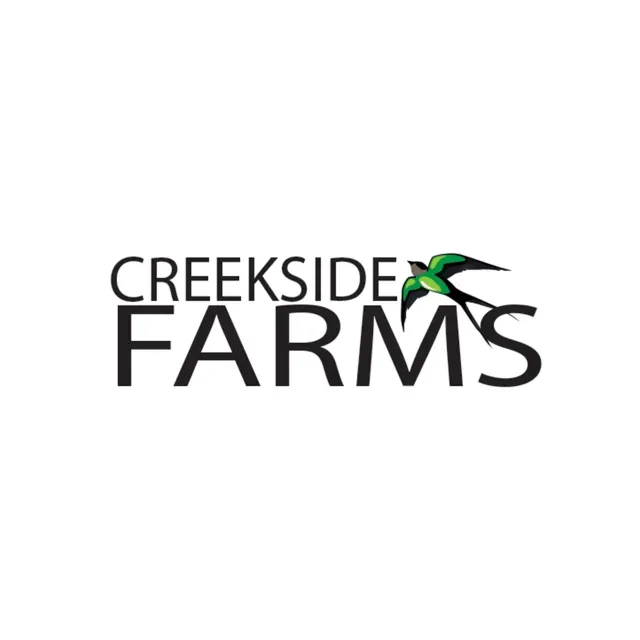 The logo for creekside farms has a bird on it.