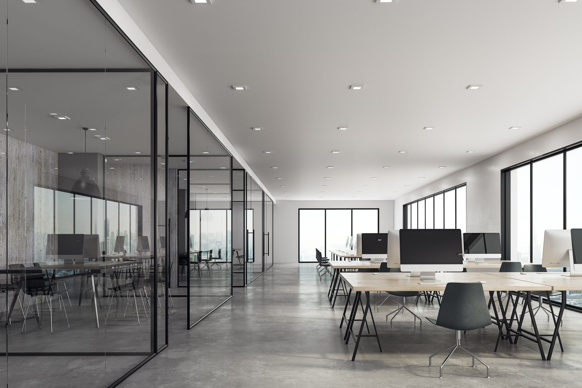 Espace de bureaux moderne avec bureaux, ordinateurs et pièces vitrées. Design lumineux et minimaliste.