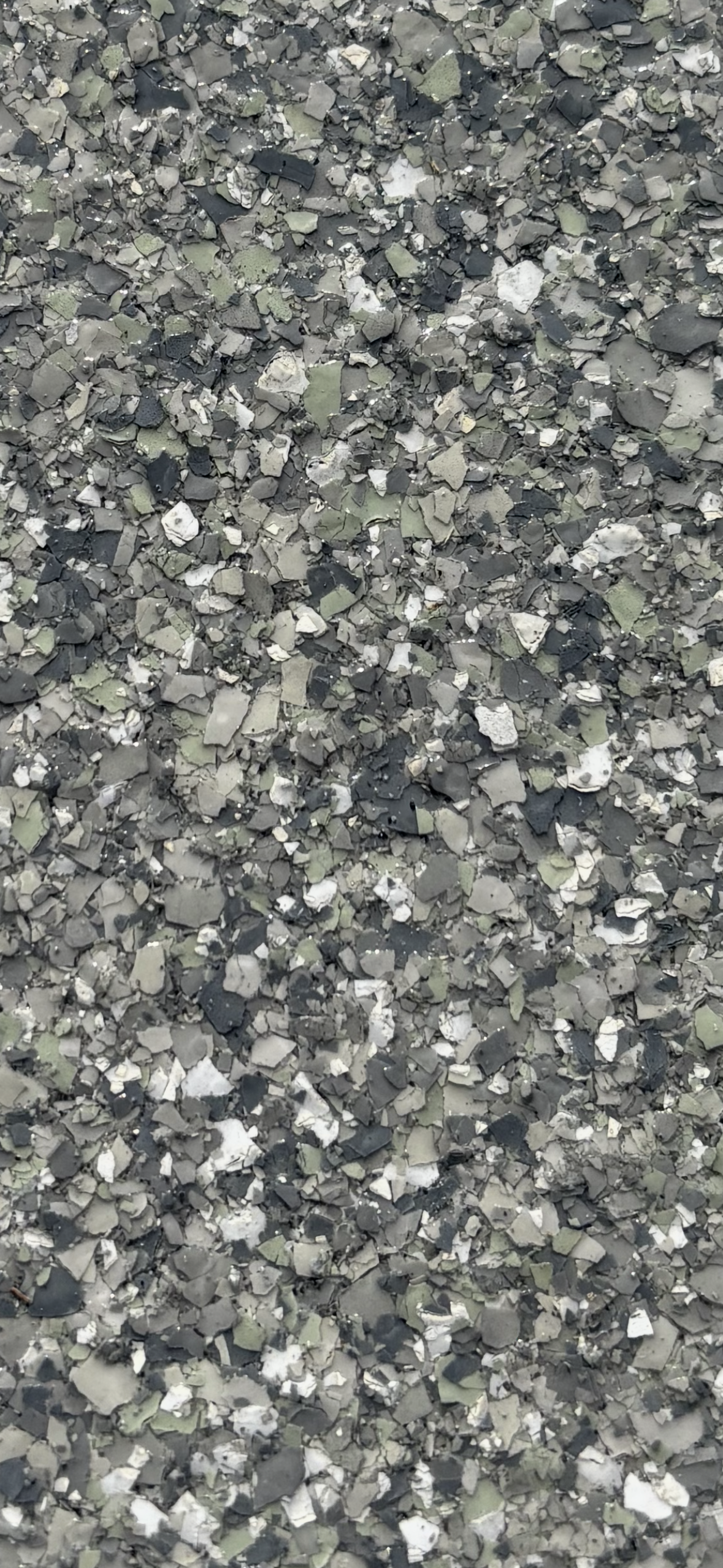 Gray speckled stone or gravel texture filling the frame