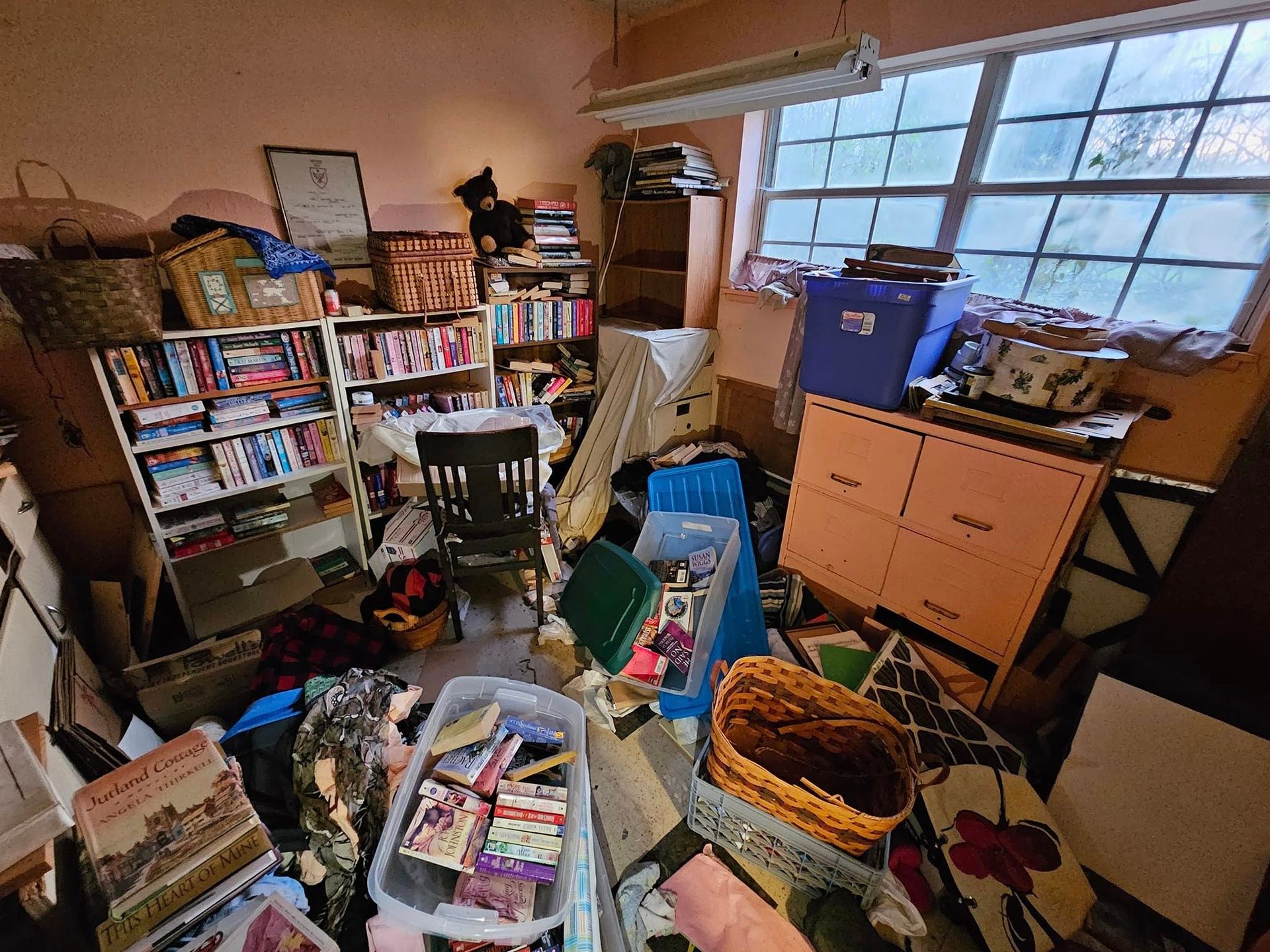 A room filled with lots of furniture and books.