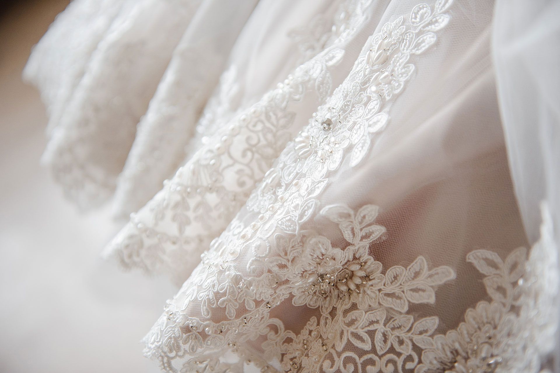 Embroidery on the dress made by wedding dress designer