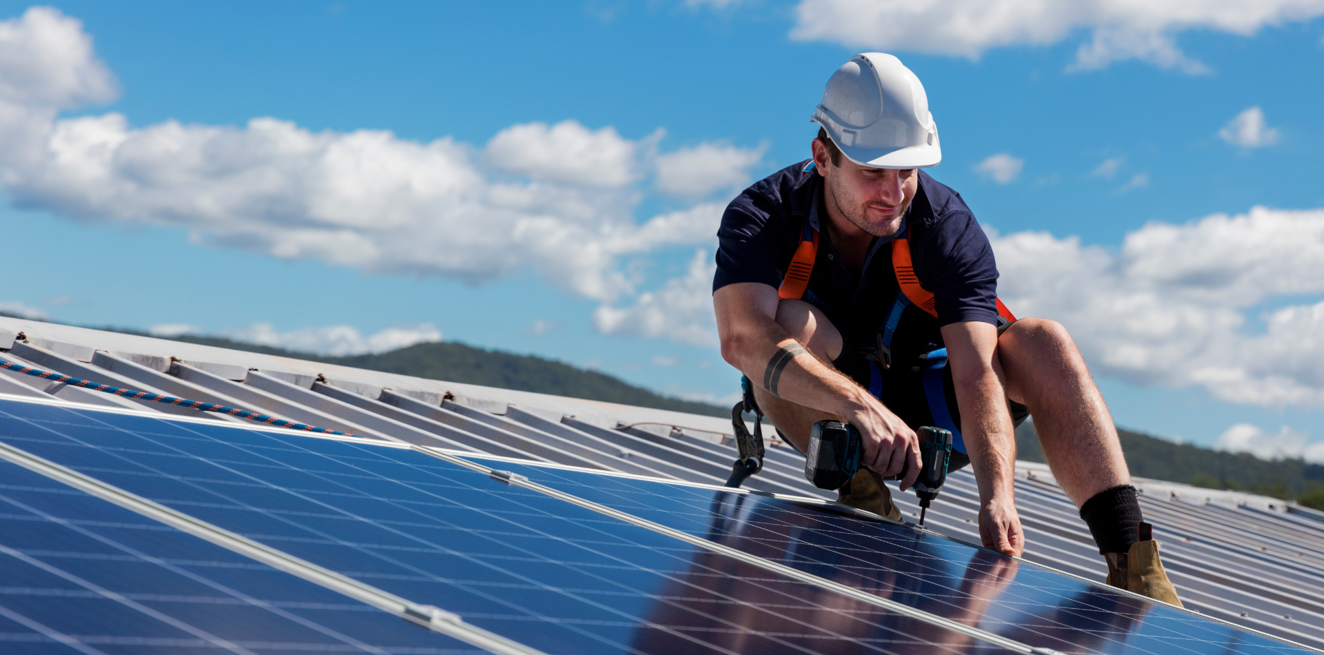 Tradesman installing Solar Panels